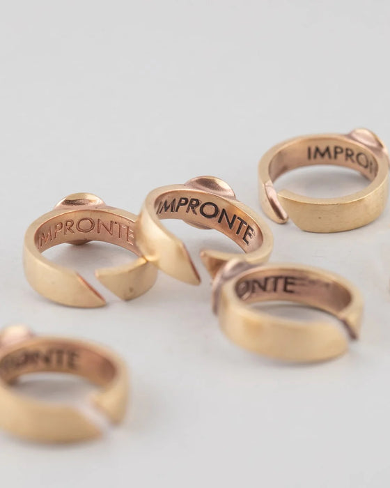 Anelli in porcellana bianca e bronzo “Cratere” in lustro oro